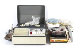 A vintage 4 track reel to reel Stellaphone tape recorder.