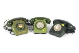 Three vintage green coloured rotary dial telephones.