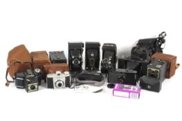 A collection of folding, box, and point and shoot cameras.