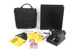 A Polaroid I Type camera and case. Together with a user manual, a folder and film.