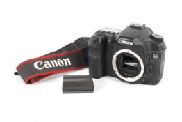 A Canon 40D DSLR camera body. Together with two batteries and an original strap.