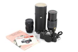 A Pentax ME Super 35mm SLR camera, black. With a 28-80mm 1:3.5-4.