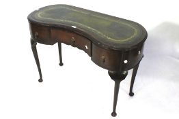 A 20th century mahogany desk of kidney f