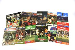 Nine assorted England football programmes.