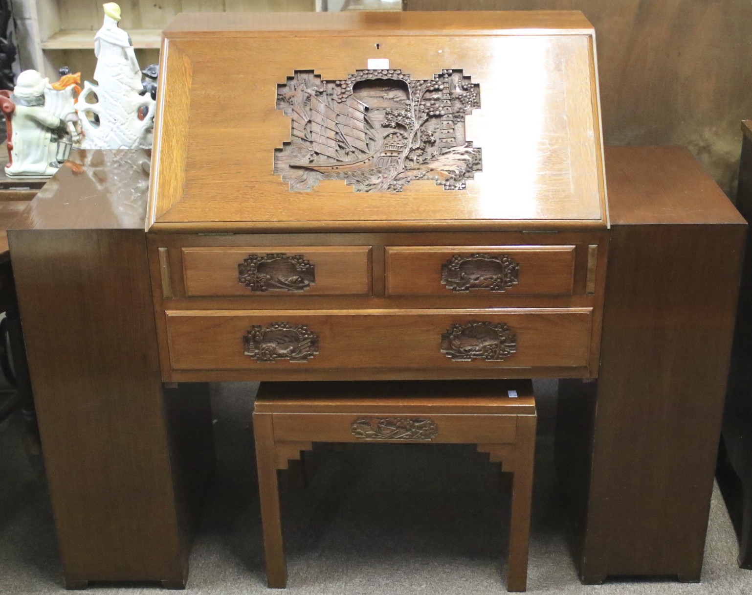 A hardwood bureau. Carved with a Chinese