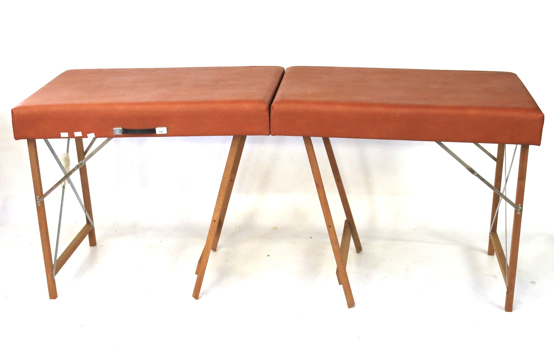 A vintage portable folding massage table