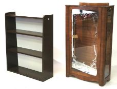 A modern brown painted bookcase and a mi
