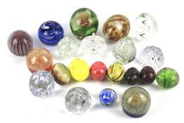 A collection of glass paperweights. Incl