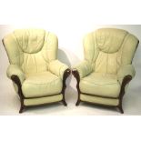 A pair of contemporary elbow chairs. Wit