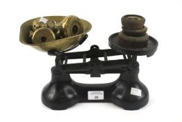 A vintage cast metal set of kitchen bala