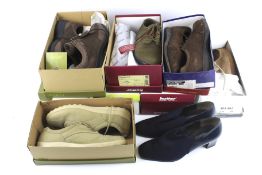 Nine pairs of assorted women's shoes. In