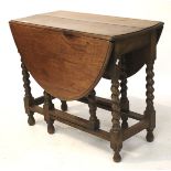 A 20th century oak gateleg table. With o
