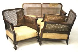A 1930s bergere style three piece suite.