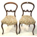 A pair of Victorian balloon back chairs