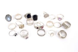 Twenty silver and white metal rings various designs total weight 78 grams.