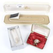 A 9ct gold cased ladies wrist watch with 9ct gold strap 21.