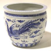 A blue and white oriental jardiniere decorated with a cloud dragon and phoenix, Dia31.5cm x H27cm.
