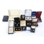 An assortment of boxed silver and white metal jewellery.