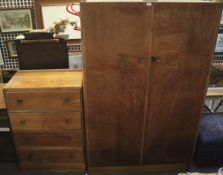 A vintage oak wardrobe and chest of drawers.