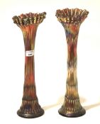 A pair of iridescent glass vases with bark effect stem and ribbed neck H39cm.