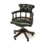 A reproduction Victorian style captains swivel chair.