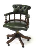 A reproduction Victorian style captains swivel chair.