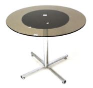 A smokey glass circular topped dining/breakfast table.