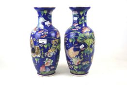 A pair of contemporary Chinese polychrome vases.