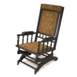An American early 20th century stained wooden rocker chair.