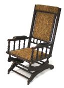 An American early 20th century stained wooden rocker chair.