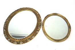Two contemporary gilt framed bevelled edge wall mirrors.