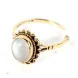 A 9ct gold ring single moonstone dress ring size P, 2.5 grams.