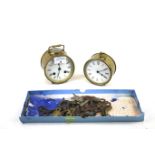 Two vintage brass cylinder barrel desk clocks. Both with white enamel dials and Roman numerals max.