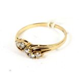 9ct gold faux diamond ring with cross over setting size O,