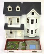 A 20th century wooden dolls house.