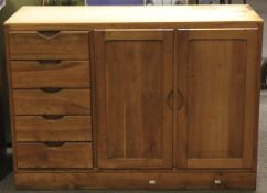 An under the counter kitchen cupboard with five drawers and double cupboard,