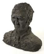 A concrete bust of a gentleman.