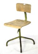 A vintage Walter swivel chair. The metal frame painted green, with a wooden seat and backrest,