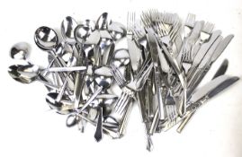 An assortment of stainless steel cutlery flatware.