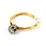 9ct gold and diamond solitaire ring set in a raised mount with open fret work decoration size N,