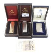 Two boxed Colibri lighters and a Dunhill lighter all in original boxes.
