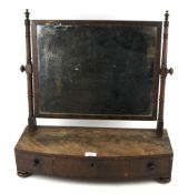 A Victorian veneered dressing table swing mirror.