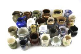 A collection of assorted pottery jugs.