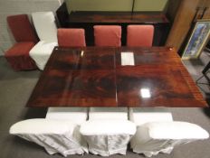 An Italian polished and black lacquered flame mahogany veneered dining suite.