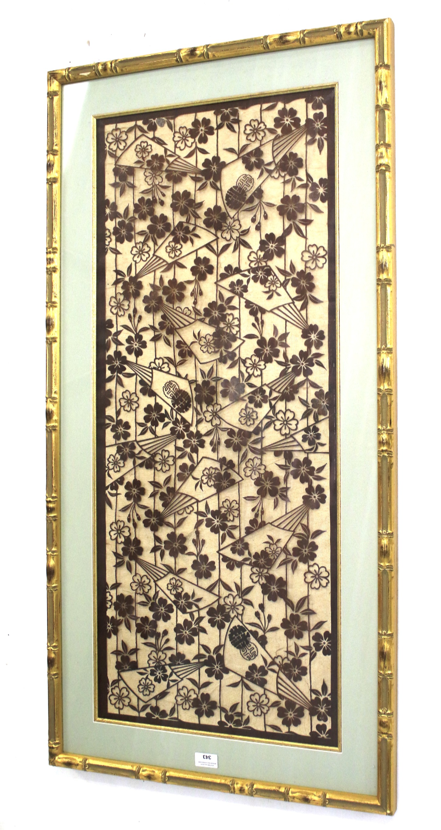 A 20th century Chinese/Japanese school segment of textile on gauze with floral and fan design.
