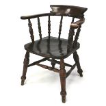 A late 19th century dark wood elm seated smokers bow chair.