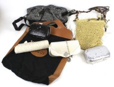 An assortment of handbags and ladies accessories.