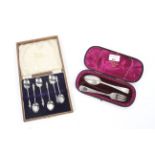 A cased silver spoon and fork set in velvet lined presentation case.