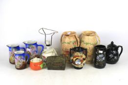 An assortment of mixed ceramics including a Poole pottery table lamp