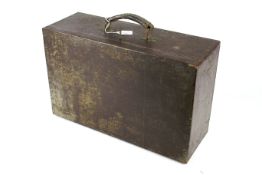 A lockable vintage wooden toolbox with leather handle.